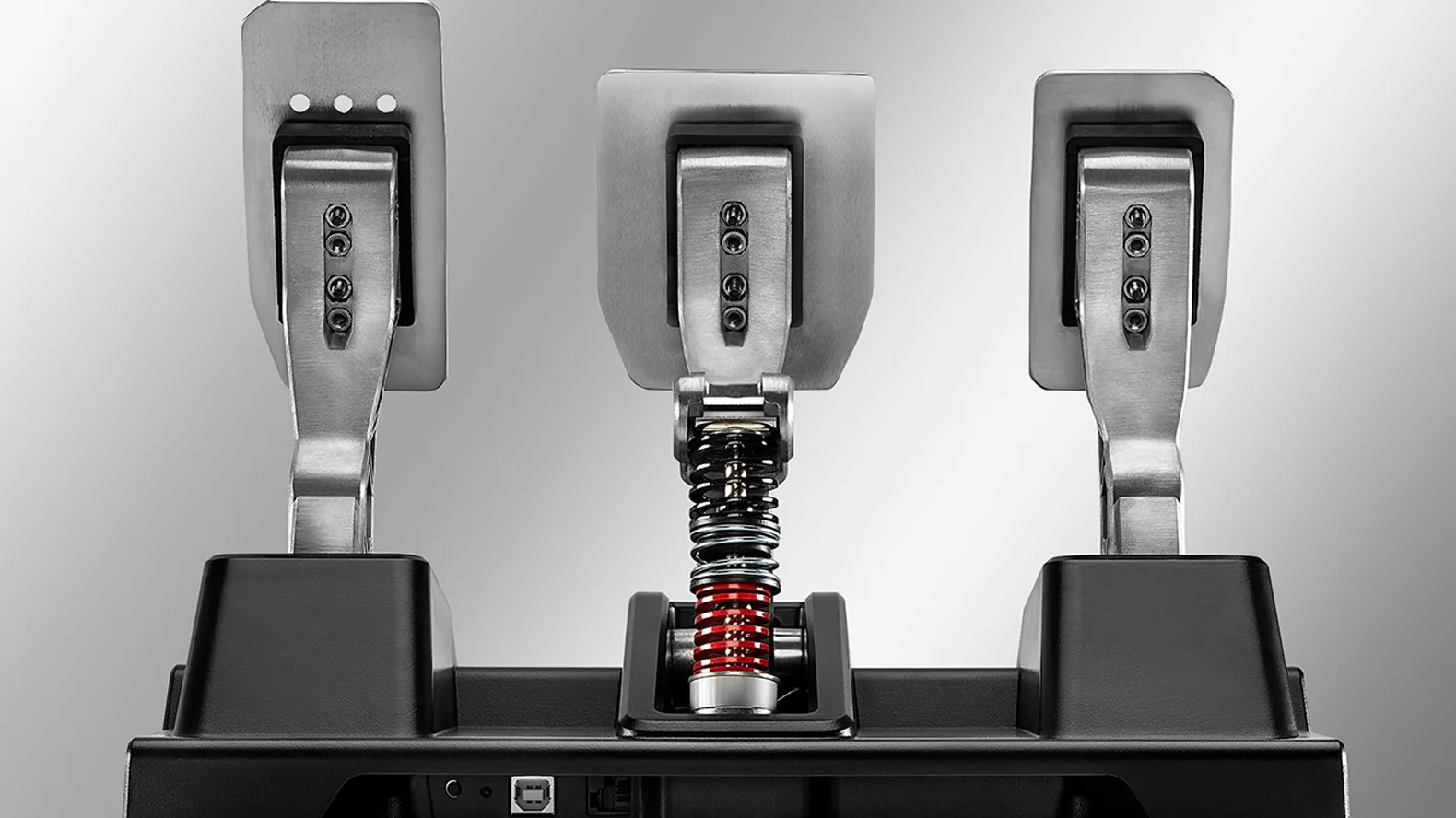 Un load cell mesure la force que vous mettez dans le frein, pas sa course : c'est ce qui construit la mémoire musculaire. Ici le T-LCM. Visuel Thrustmaster.